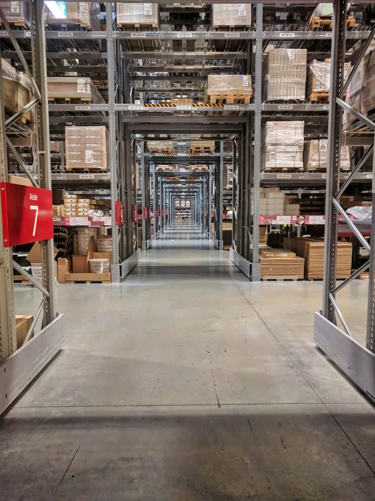 Distribution warehouse with stocked shelving and boxes