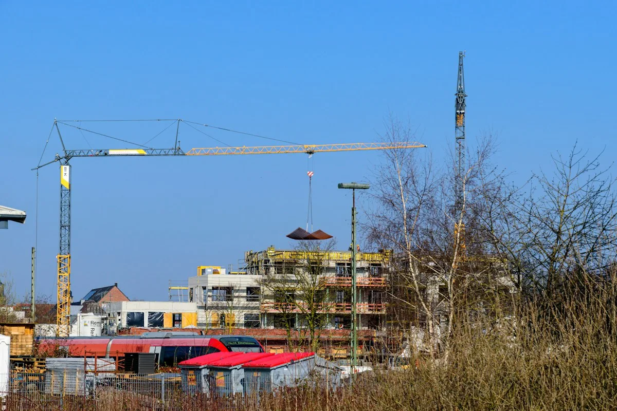 Infrastructure construction site with cranes and structural works